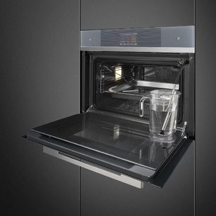 Компактный духовой шкаф с пароваркой Smeg SF4104WVCPS фото 2 в Казани и Татарстане