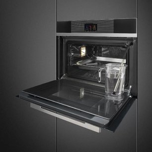 Компактный духовой шкаф с пароваркой Smeg SF4104WVCPN фото 2 в Казани и Татарстане